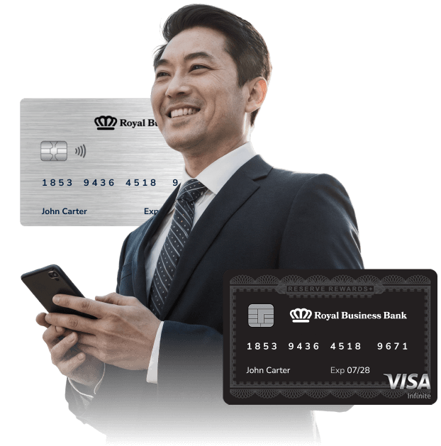 businessman using mobile banking services on his phone, along with two types of credit cards